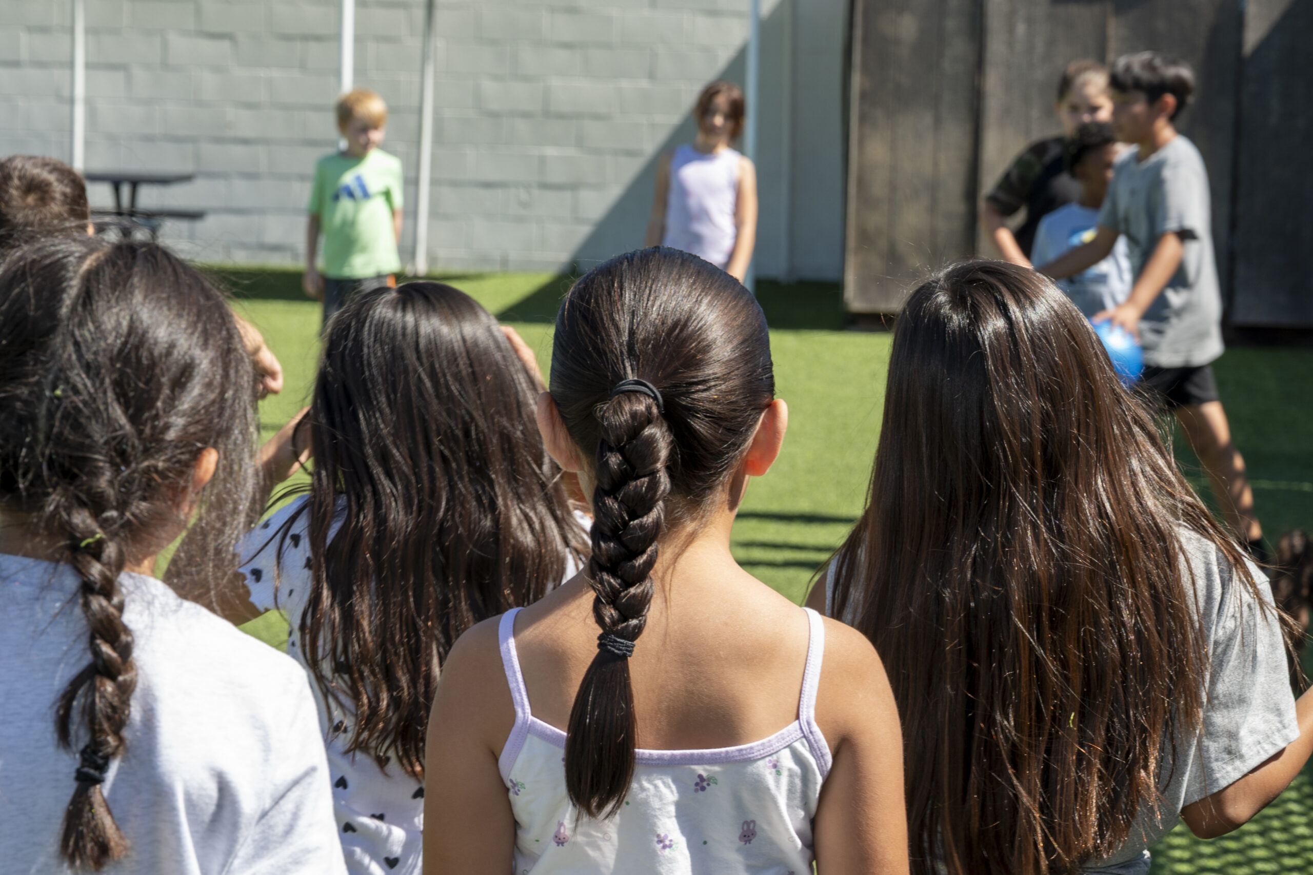 School-age children spending time together outdoors at Cherry Blossom Childcare & Preschool